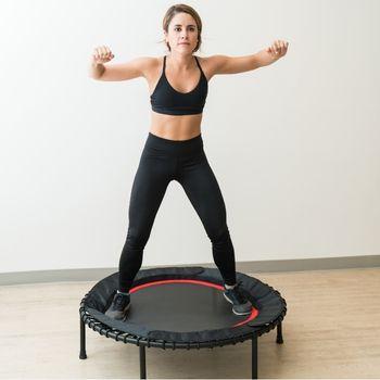 Woman Jumping on Rebounder to Improve Lymphatic Drainage